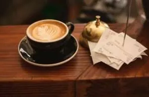 Thermal POS Receipt Printers: Cloud, WiFi, Ethernet & USB 70 Coffee cup and receipts in a cafe.