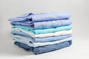 NTEP Certified Scales for POS 35 Stack of folded laundry from wash-and-fold service.